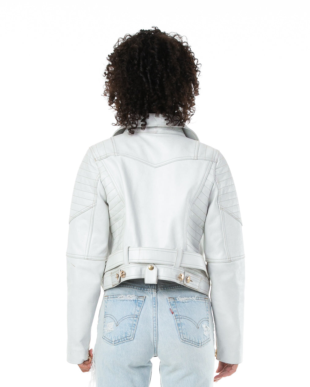 Backside of female model wearing Prince leather jacket