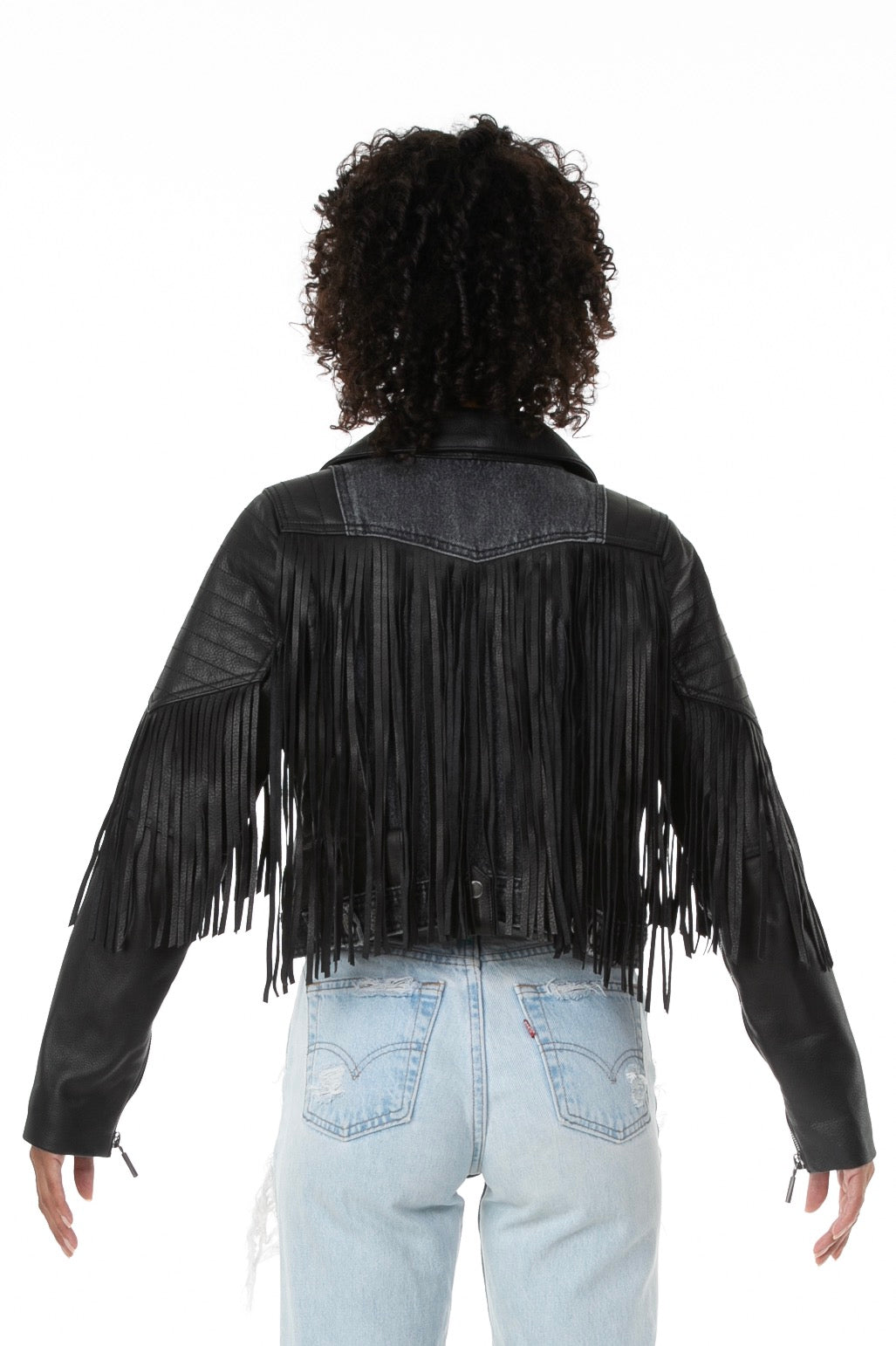 Backside of female model wearing La Matadora leather jacket