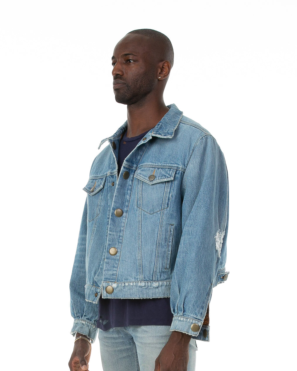 Side of male model wearing Dynasty Reversible Denim jacket