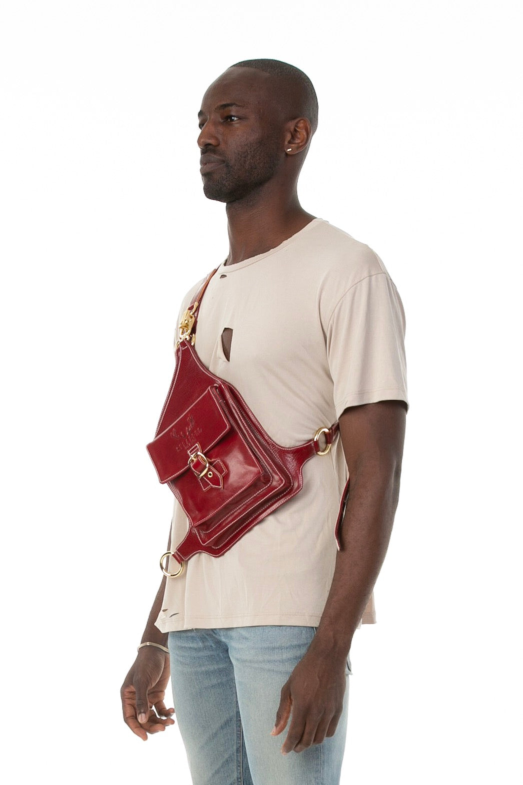 Side of male model wearing Holster Bag in Red
